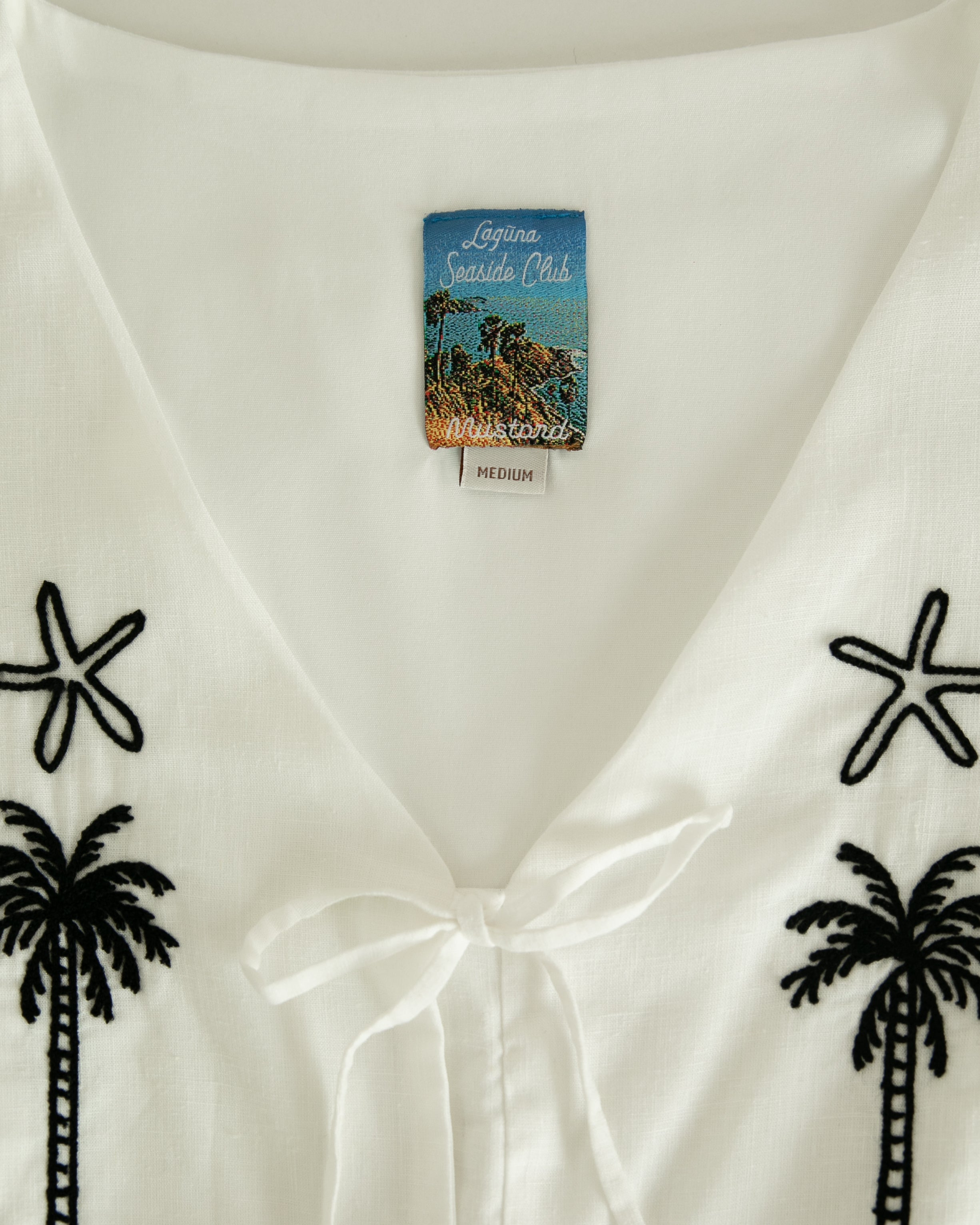 เสื้อกั๊ก Laguna Palms - สีขาว